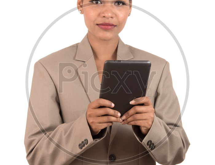Indian business woman using a tablet smartphone