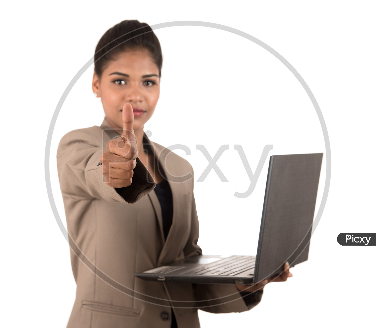 Young Indian business woman with a laptop giving a thumbs up