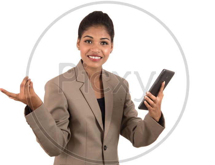 Smiling Indian business woman using a tablet phone