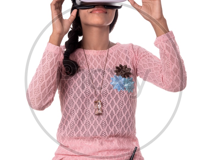 Beautiful Indian Girl Looking Through VR Device , Indian Girl Wearing Virtual Reality Headset  on a White Background