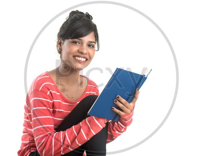 Pretty Young Girl Holding Book and Posing On White Background