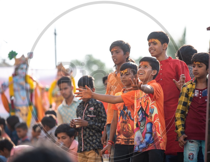 Smiling young boys with sandal wood tilak at Shri Rama shobha yatra in Hyderabad