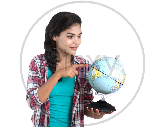 A Pretty Young Girl Holding World Globe In hand And Posing on White Background