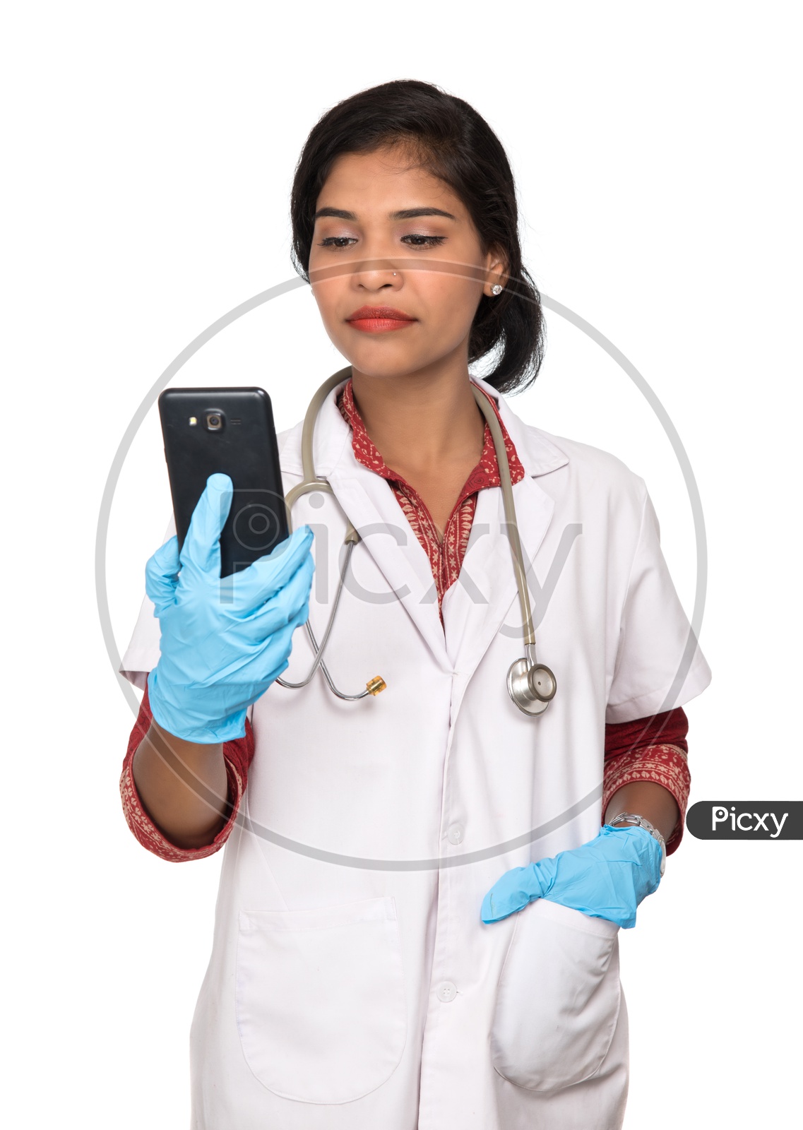 Indian Female Doctor checking her phone
