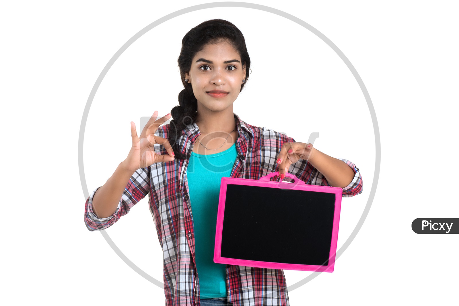 Young Indian Girl Showing a Slate Board  and Pointing The Empty Space on an Isolated White Background
