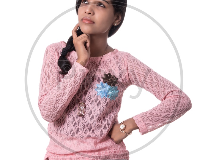 Portrait Of a Young Girl Thoughtfully Thinking and Posing On a White Background