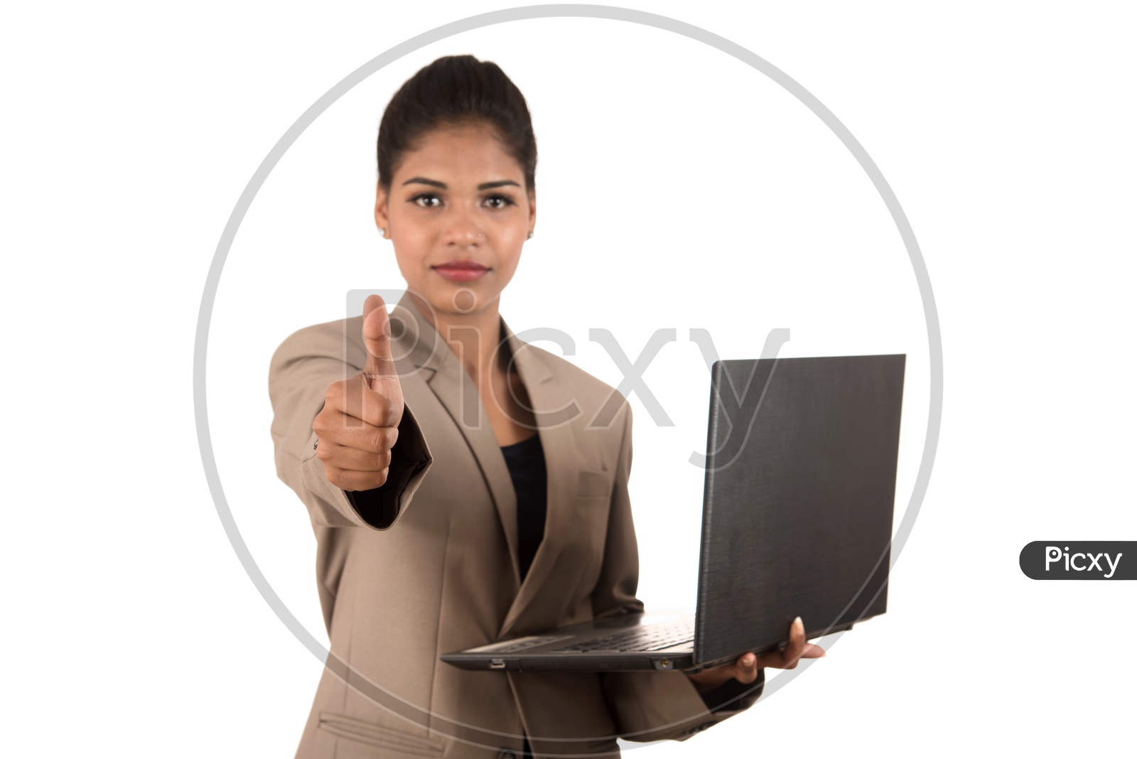Young Indian business woman with a laptop giving a thumbs up sign