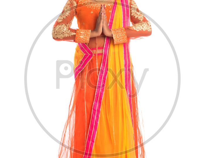 A Young Traditional Indian Woman  With Namaste Gesture And With Smile Face on an Isolated White Background