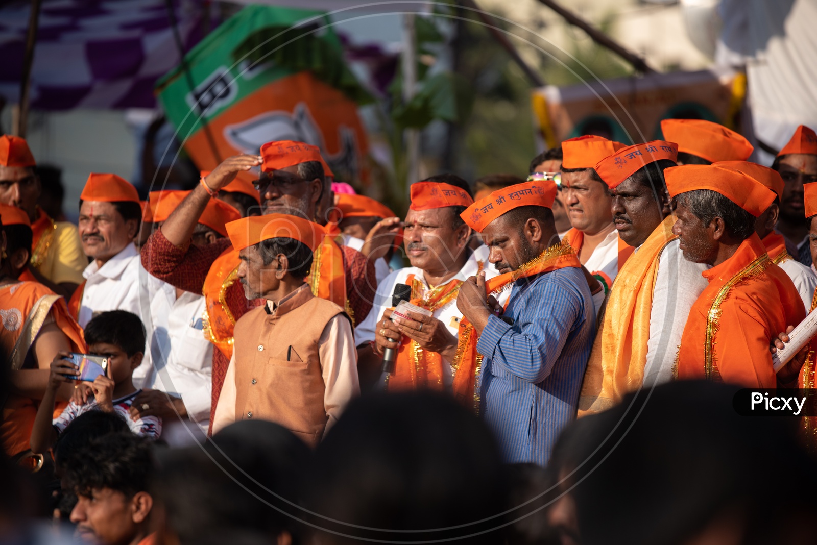 People wearing saffron caps during Shri Rama Shobha Yatra in Hyderabad