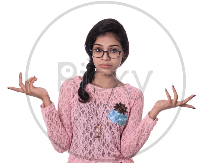 Innocent Young Indian Girl With Cute Expressions on Her Face  On White Background