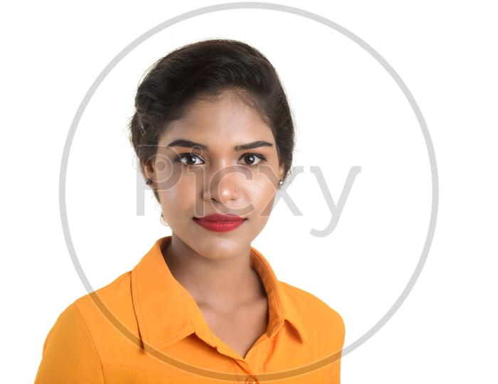 Portrait of beautiful Indian woman wearing makeup with orange shirt