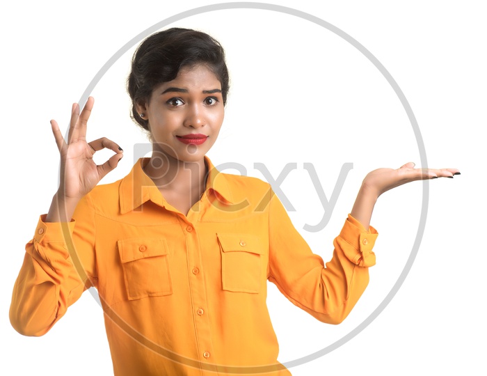 Young Girl Holding Something and with a Gesture And Expression About Space On an Isolated White Background