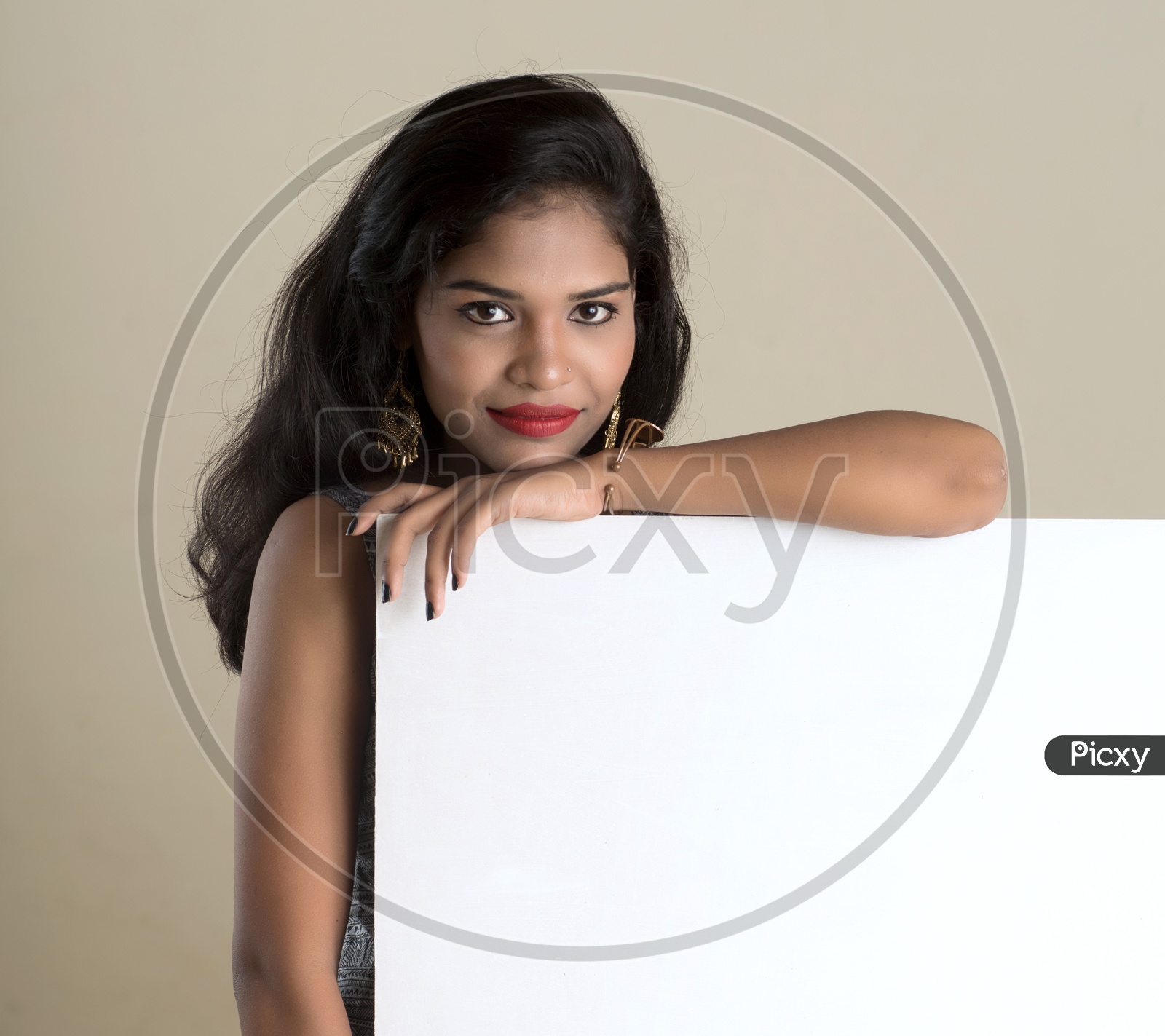 Pretty young Girl Showing Empty Placard With Space and With Expression On Face on an Isolated White Background
