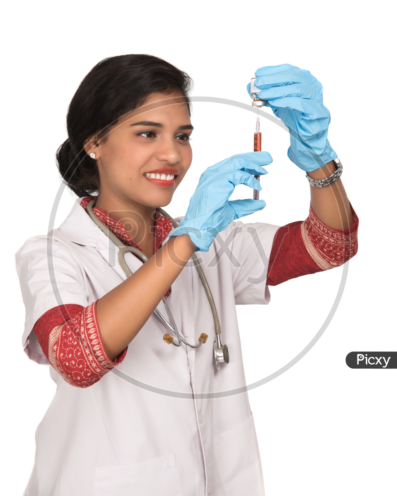 Indian Female Doctor loading a syringe