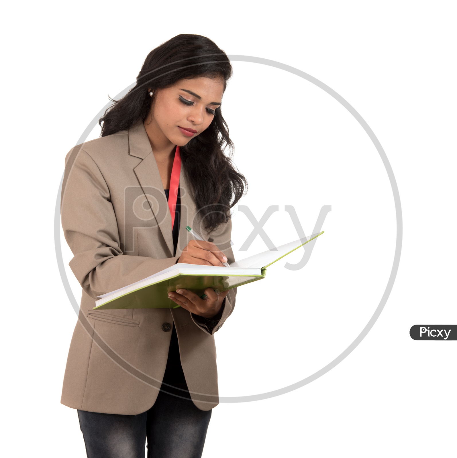 Indian business woman writing in a book