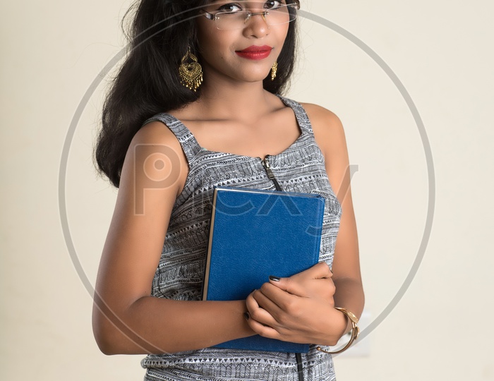 Indian woman holding a book