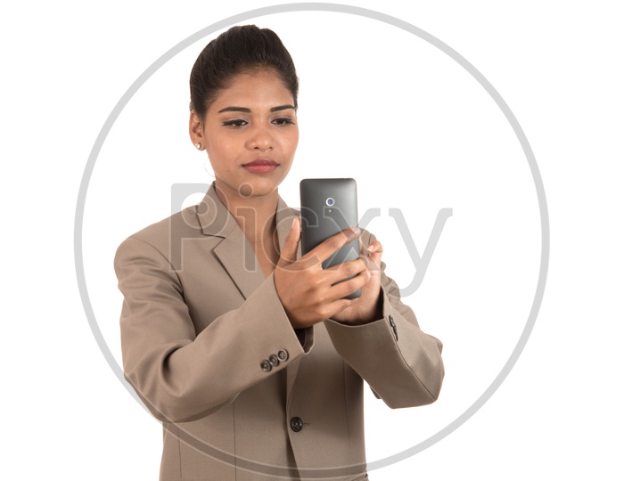 business woman using a mobile phone or smartphone isolated on a white background