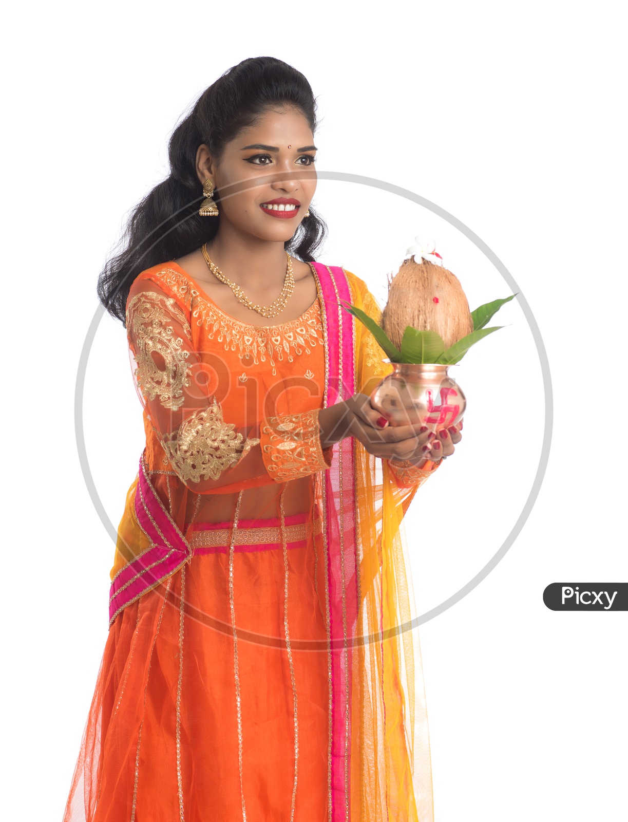 A Young Traditional Indian Woman Holding  Copper  Kalash In Hand and Posing Over a White Isolated Background