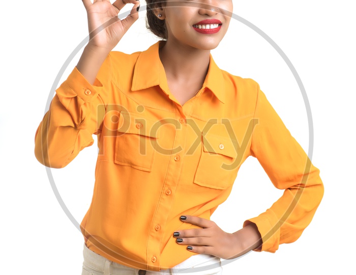 Young Girl With a Smile Face And Doing Gesture On a Isolated White Background