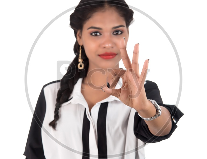 Pretty Young Indian Girl With Gesture and Smile on Face And Posing On an Isolated White Background