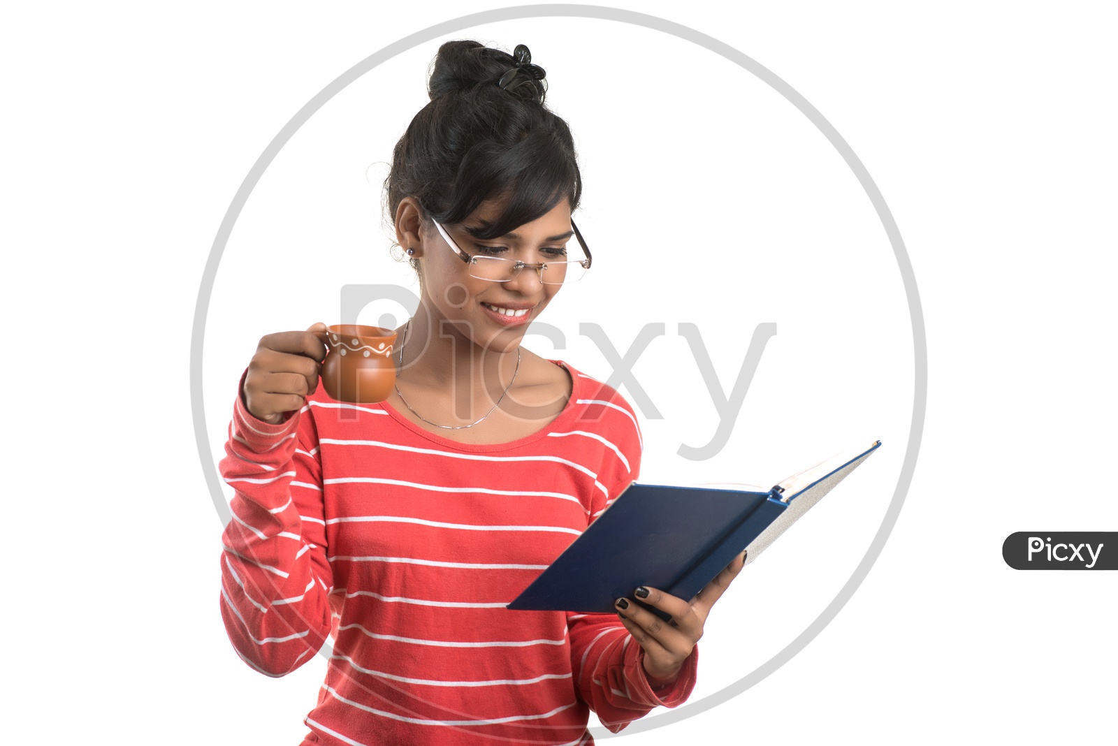 Pretty Young Girl Student Holding Book and With a Cup Of Coffee or Tea  and  Posing on an isolated White Background