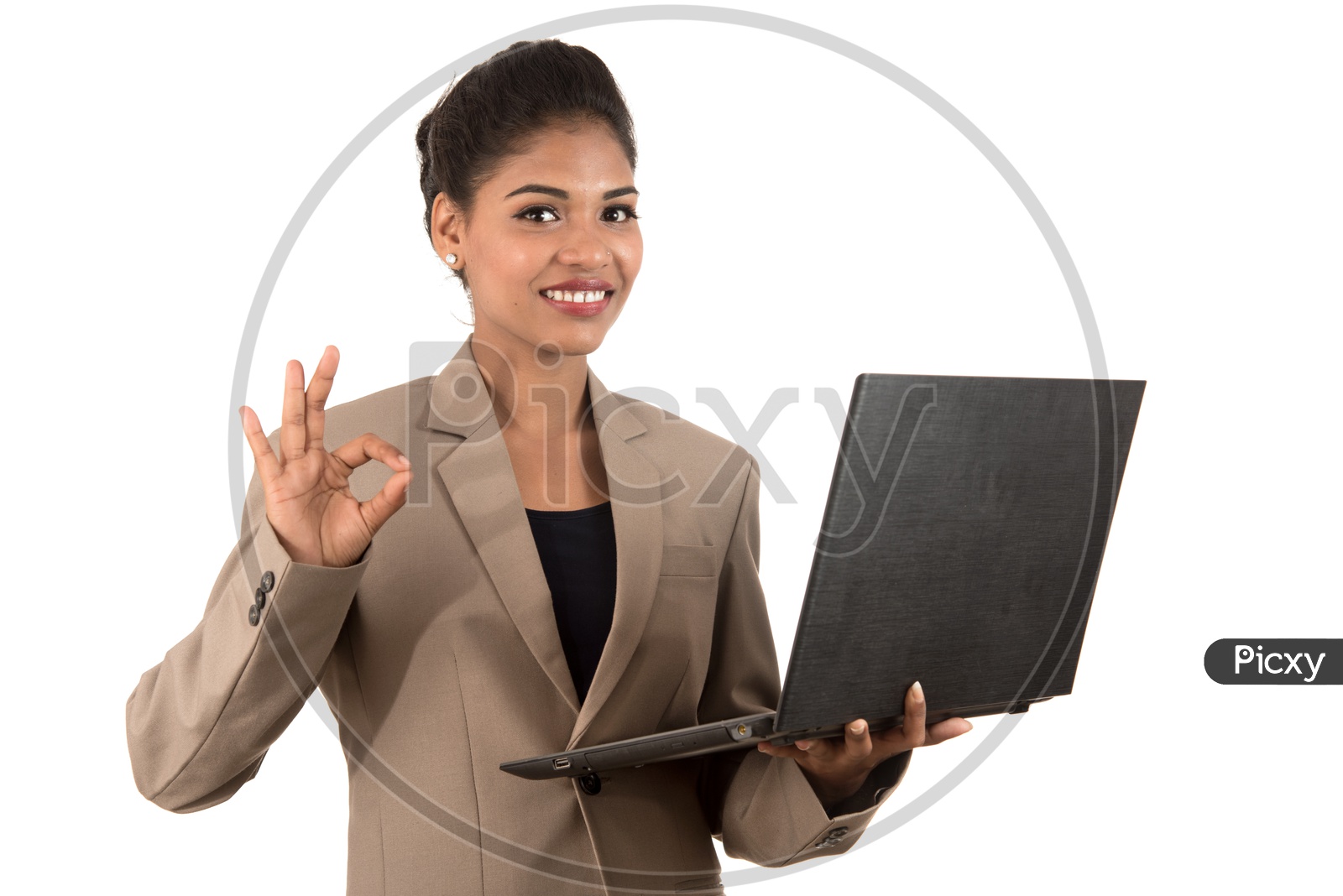 Young Indian business woman with a laptop making a super sign