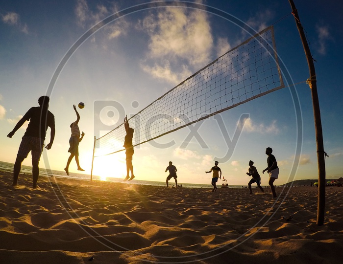 People Playing Beach Volleyball In a Beach
