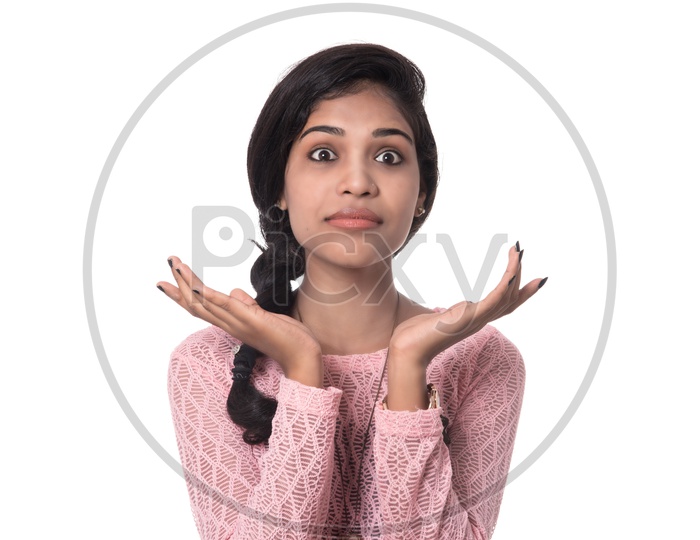 Portrait Of a Young Innocent and beautiful Girl  Posing with an Expression On White Background
