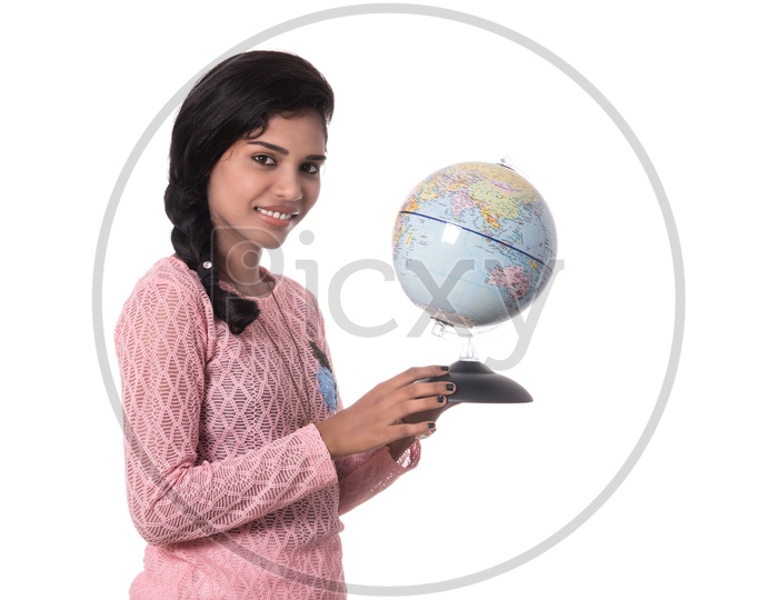 Young Indian Girl Holding World Globe In hand And Posing On a White Background
