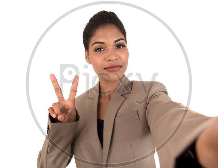 Beautiful young businesswoman using smartphone to take selfie photo isolated on white background