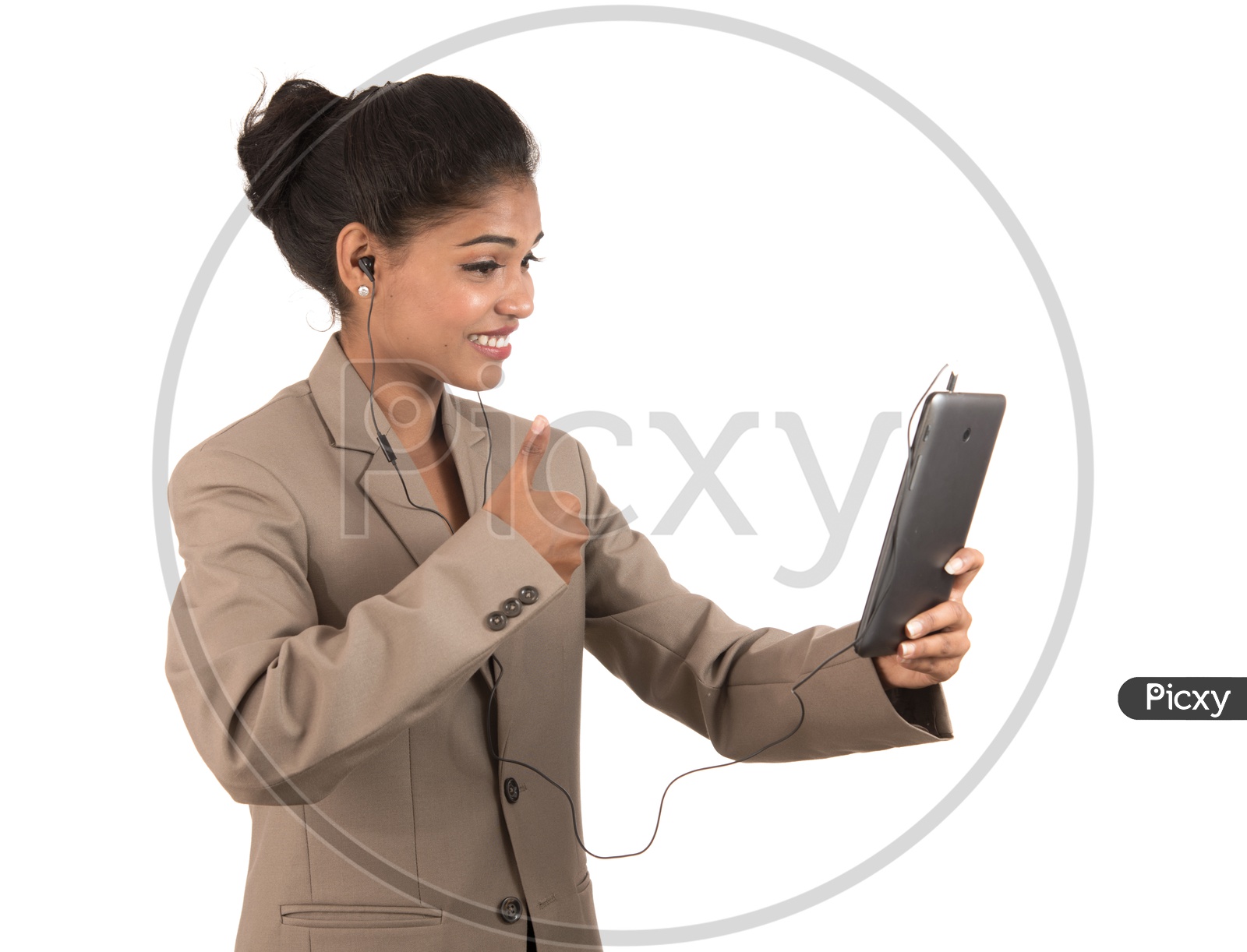 Young Indian business woman making a video call using tablet smartphone