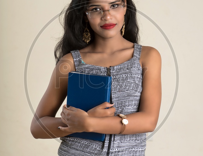 Indian woman holding a book