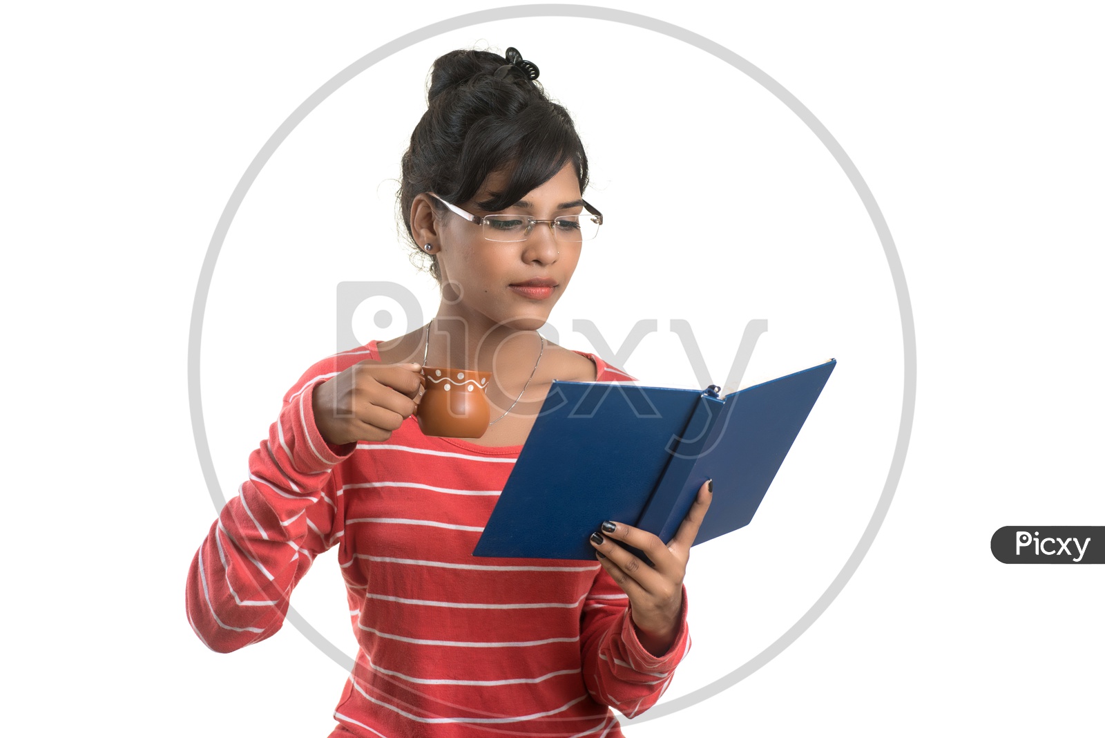 Pretty Young Girl Student Holding Book and a Cup Of Tea or Coffee and  Posing on an isolated White Background