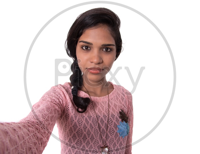 A Young Indian Girl Taken Selfie With an Expression in Smart Phone