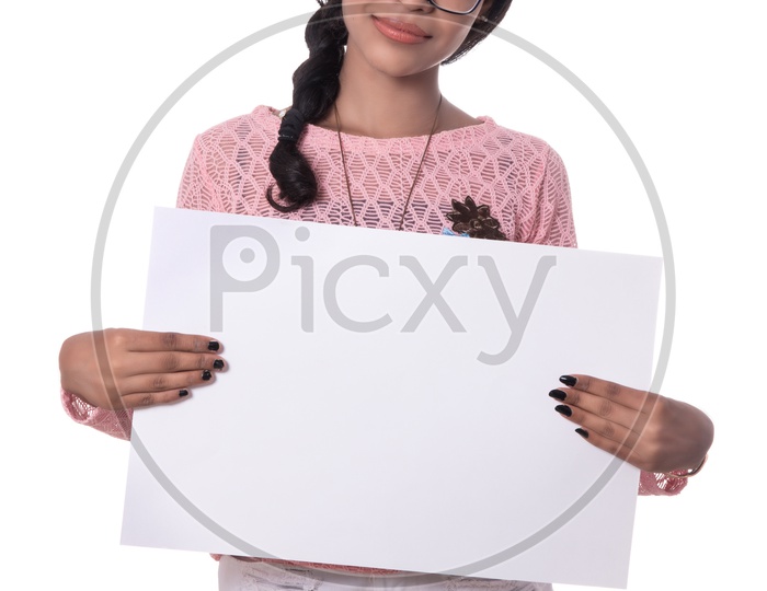 Attractive Indian Girl Holding an Empty Placard And   Pointing The Space on Board