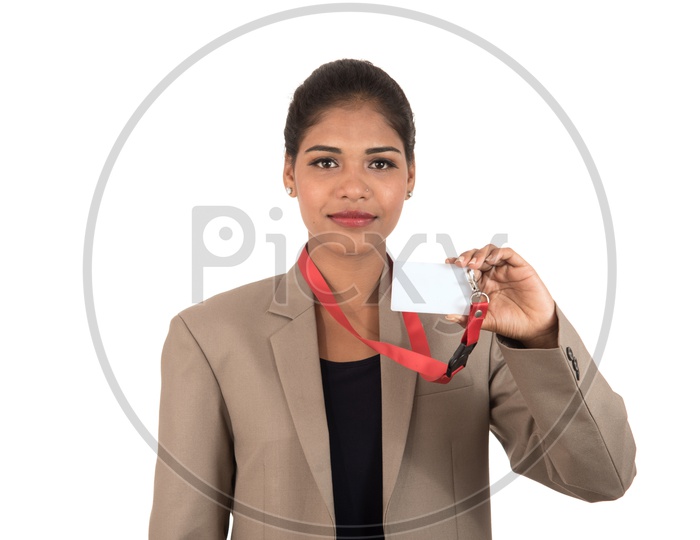 Smiling Indian business woman holding a blank business card or ID card