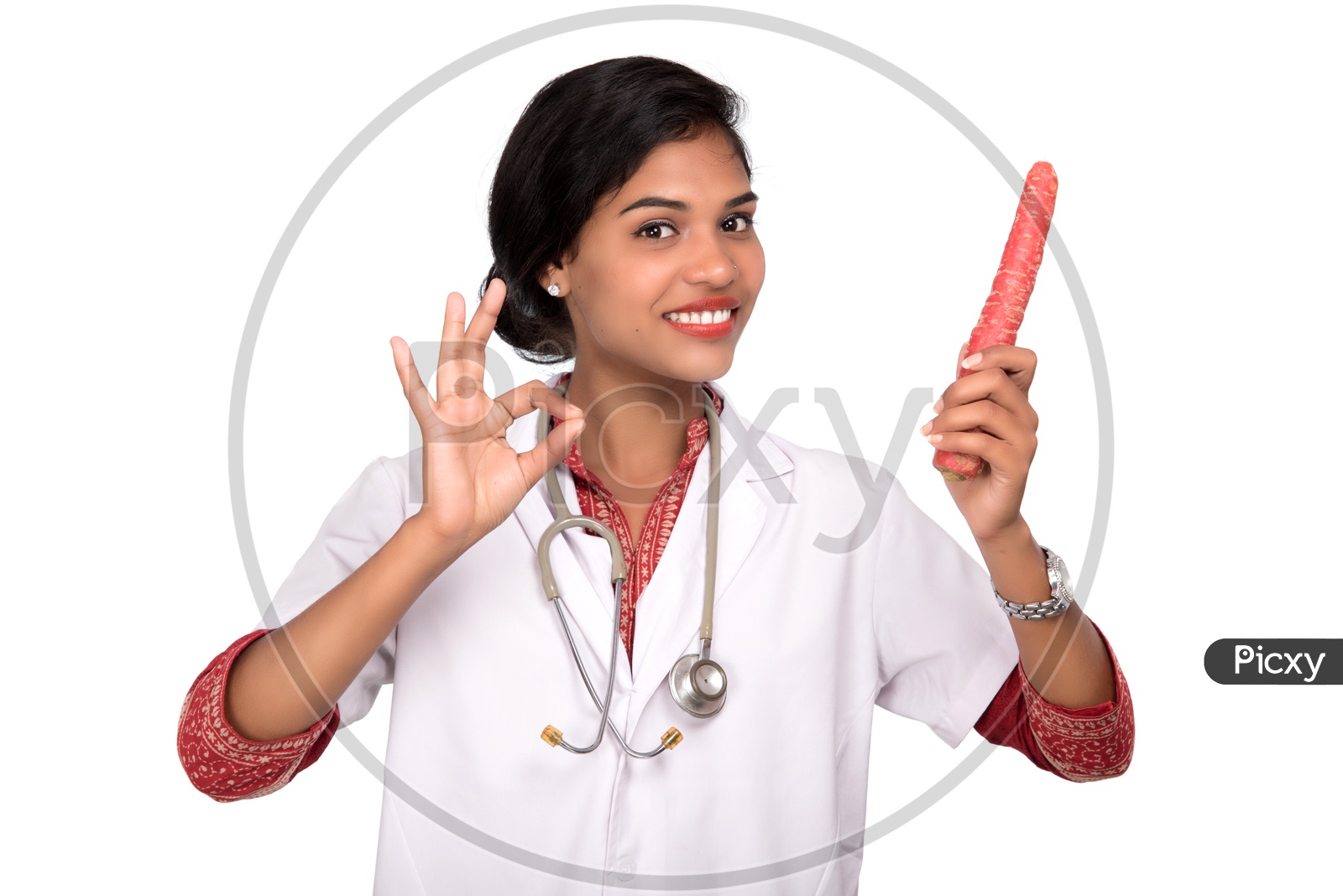 Indian Female Doctor holding carrot making a super sign