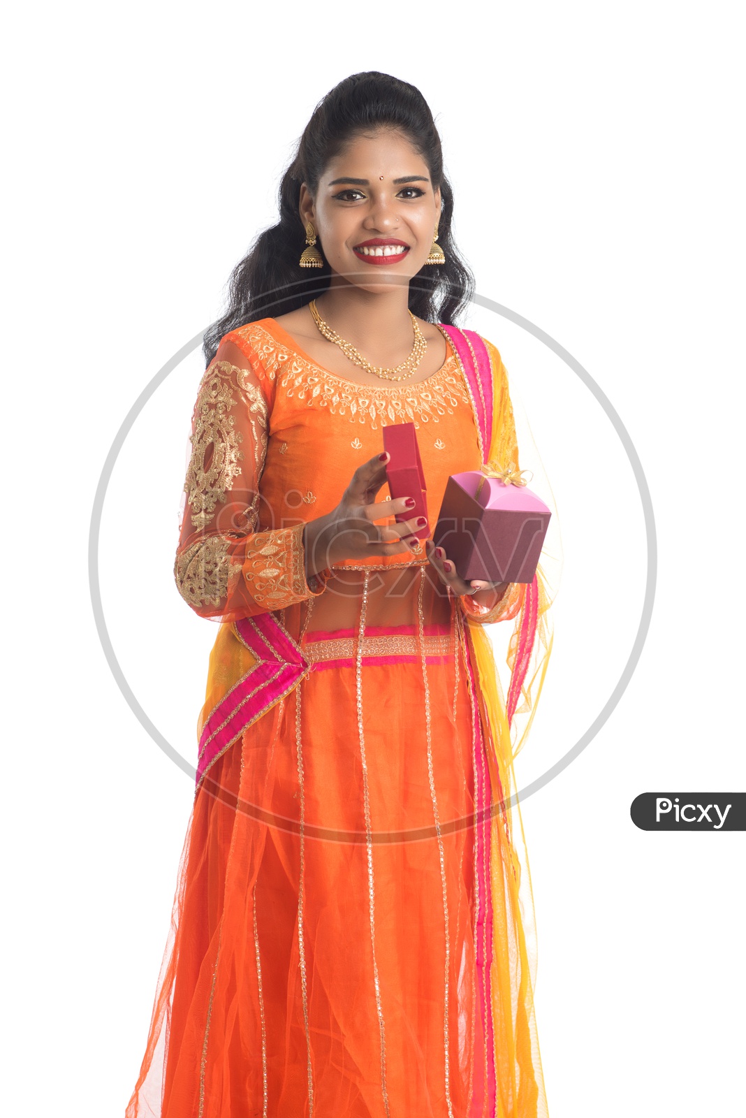 Young Traditional Indian Woman Holding Gift Boxes or Festival Gift Boxes  In hand With a Smile Face On an Isolated White Background
