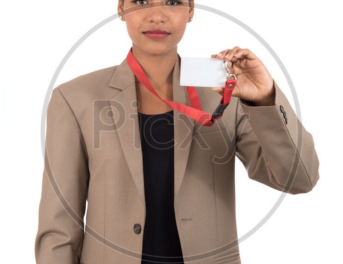 Smiling business woman holding a blank business card or ID card