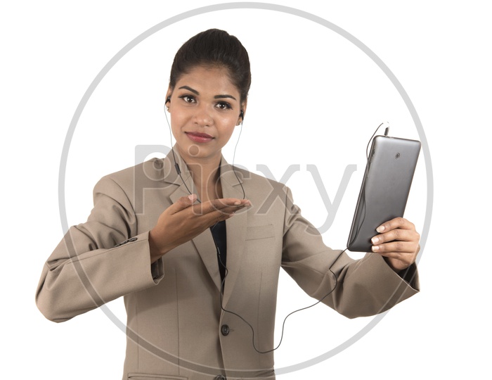 Young Indian business woman using a tablet smartphone
