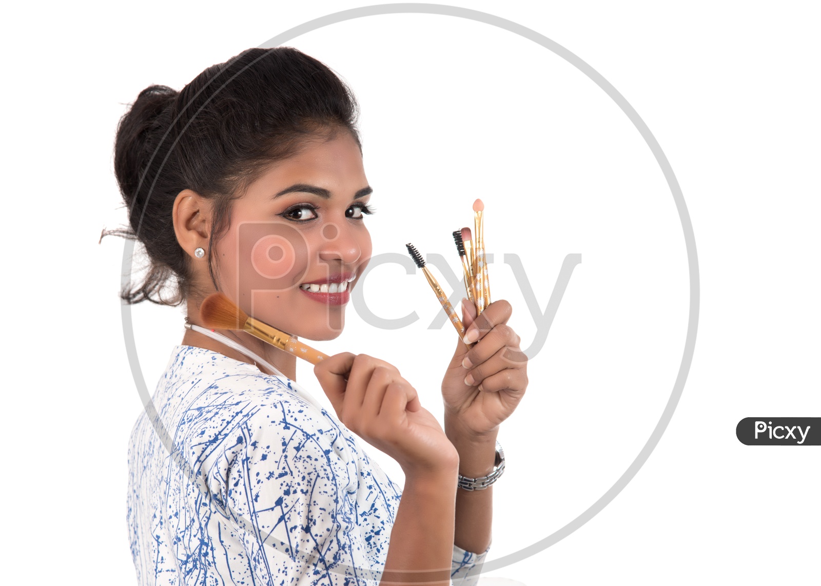 Young Beautiful Girl Enjoying With Makeup Brush On an Isolated White Background