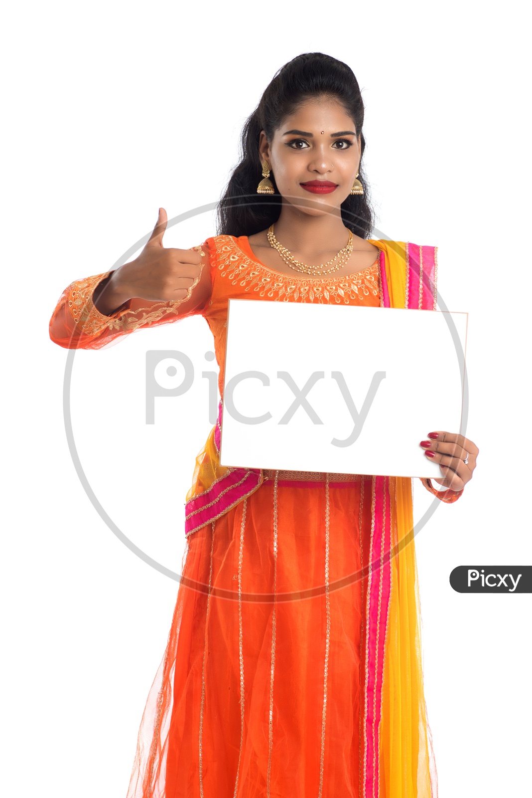 A young pretty Indian woman holding a blank white board or card with a gesture