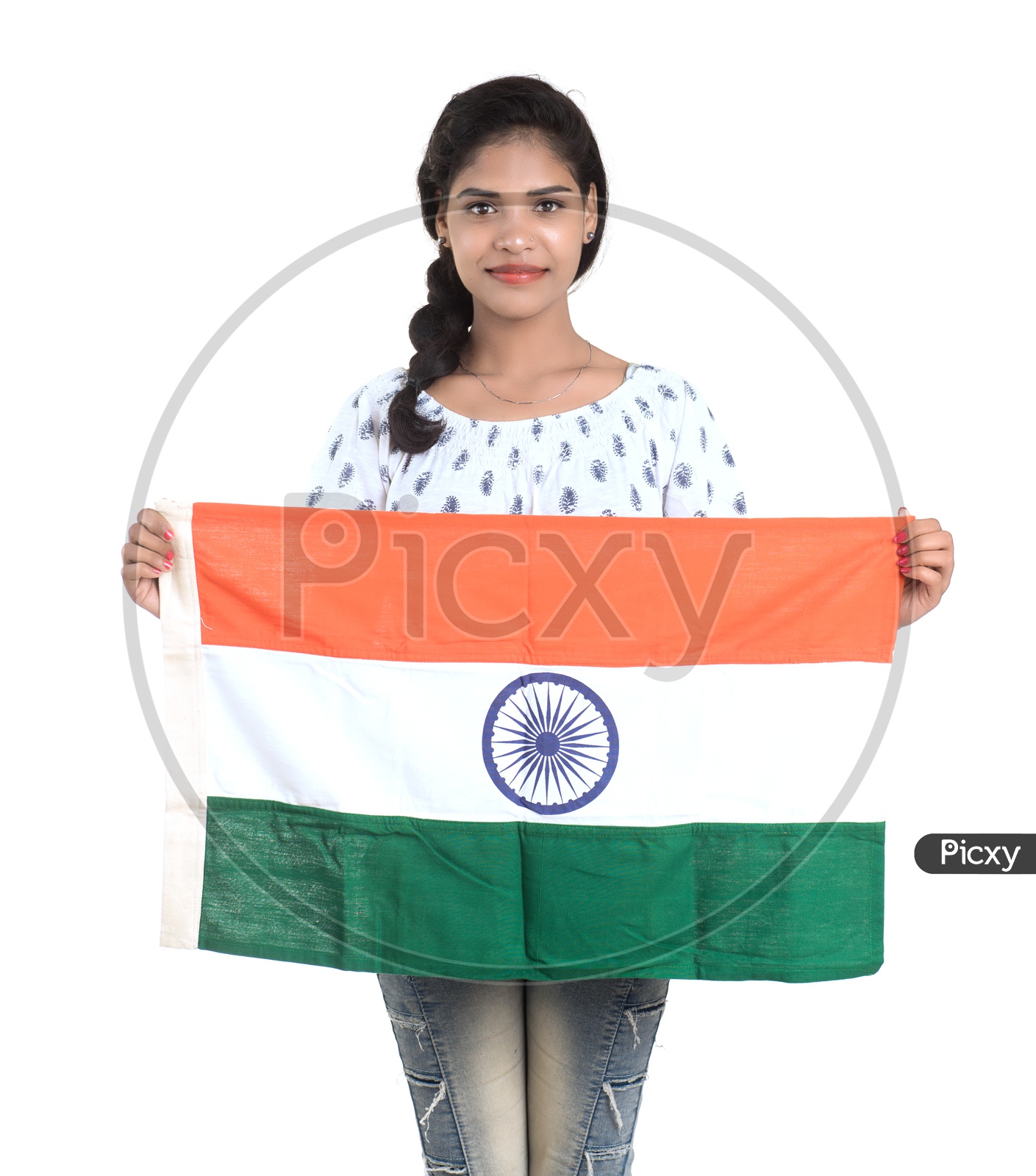 Young Indian Girl Holding Indian national Flag or Tri color Flag in hands And Posing Over a White Background
