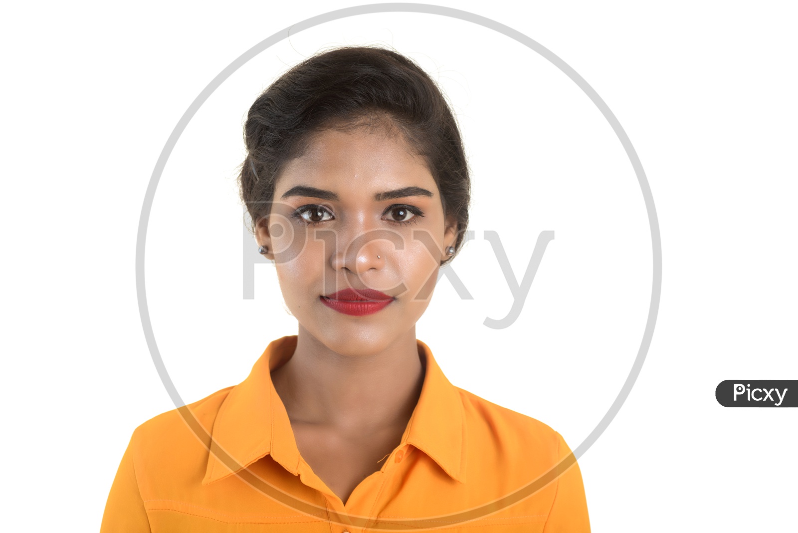 Portrait of beautiful Indian woman wearing makeup with orange shirt
