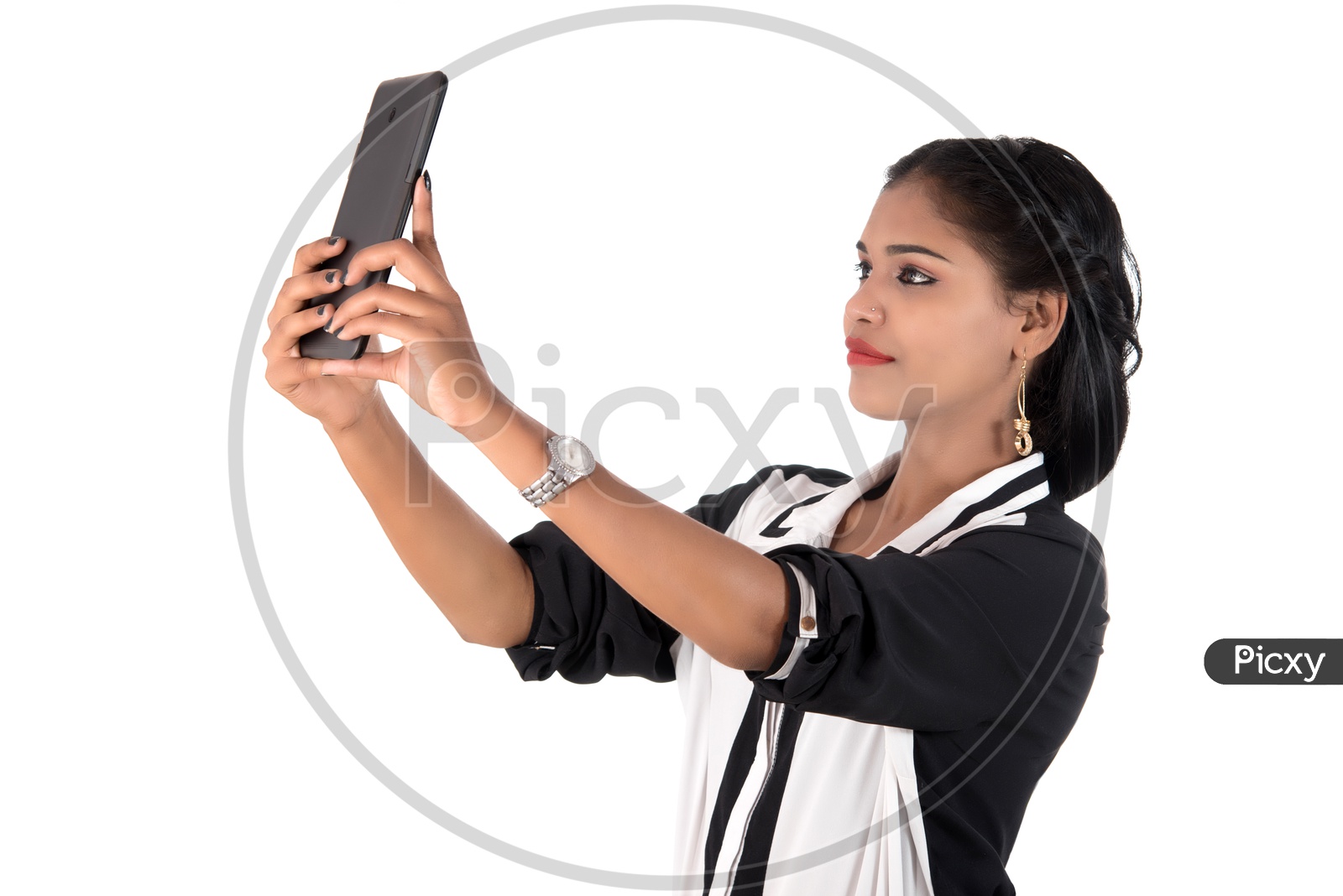 Pretty Young Indian Girl Taking Selfies In Smart Phone On an Isolated White Background