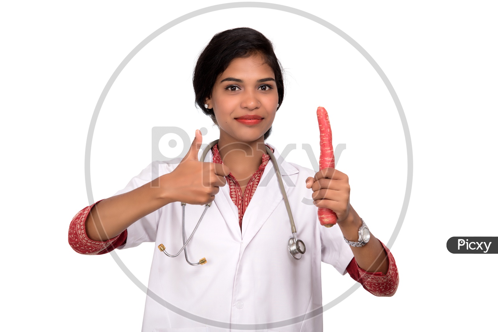 Indian Female Doctor holding carrot making a thumbs up sign