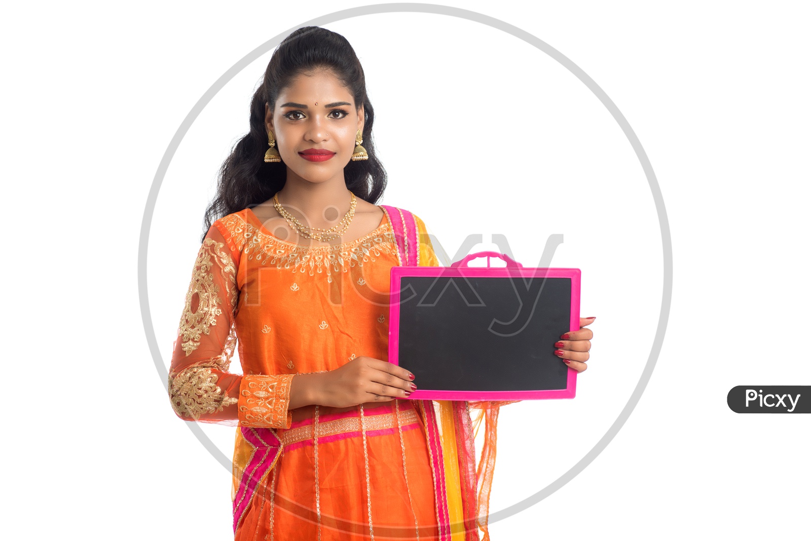 A Young traditional Indian Girl Holding a Blank Slate Board  And Showing The Space With Smile Face On an Isolated White Background