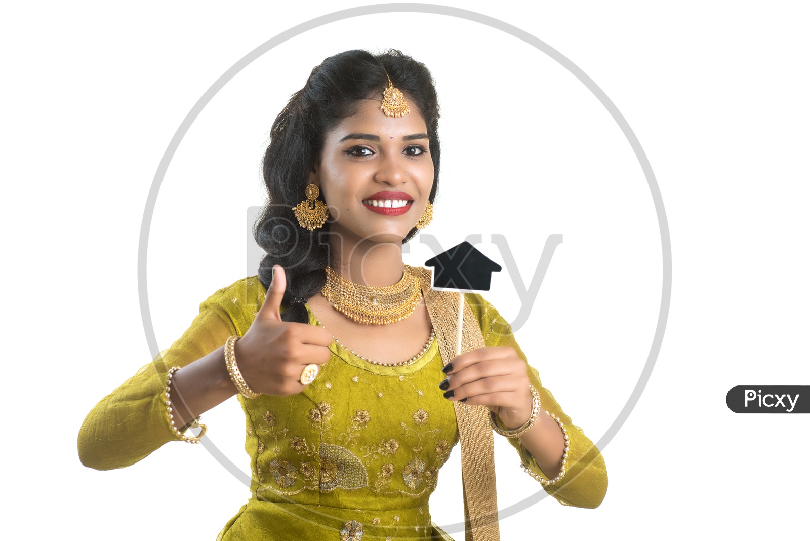 Happy Traditional Woman Holding A Little House Cutout Board in Her hand on an Isolated White Background