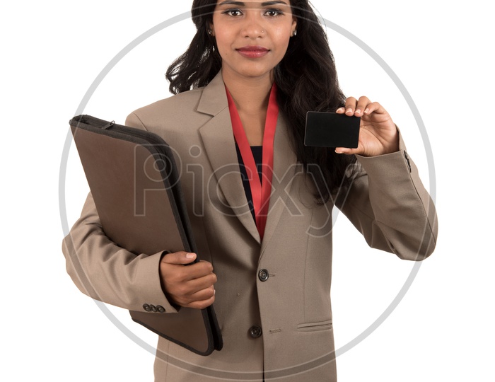 Smiling business woman holding a blank business card or ID card and a folder