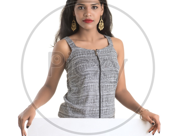 Indian woman holding a white board